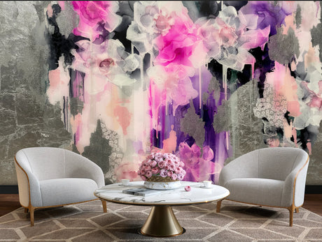 This living room staging of a large floral wallpaper design. The staging includes grey and wood tub chairs, marble coffee table and patterned floor rug.