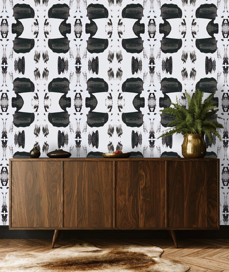 This entry way interior design concept features a large pattern black and white wallpaper design. The monochromatic design is inspired by the mountain silhouettes of the Santa Fe skyline and the repeating patterns of early Pueblo pottery. This design brings intrigue and texture to any living room or entry way decor.