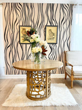 Explore this unique wallpaper pattern featuring curved lines and brushstrokes. This black and beige large pattern design makes a stunning feature wall for hotel lobbies, salon walls, spa entrance decor and residential living room spaces. The design is available in prepasted, french luxe and peel&stick materials. Custom wallpaper sizes are available.