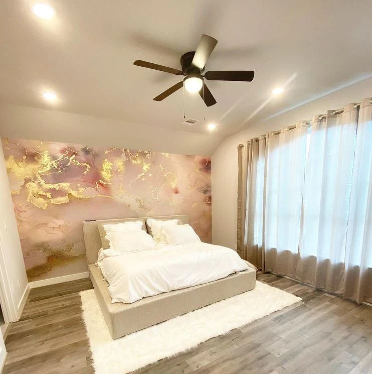 This bedroom interior design project used peel and stick wallpaper with the Vivian Ferne abstract design, Sedona. This wallpaper design uses real gold leafing, wispy blush and pink colors and grey undertones to create a marvelous interior design installation.