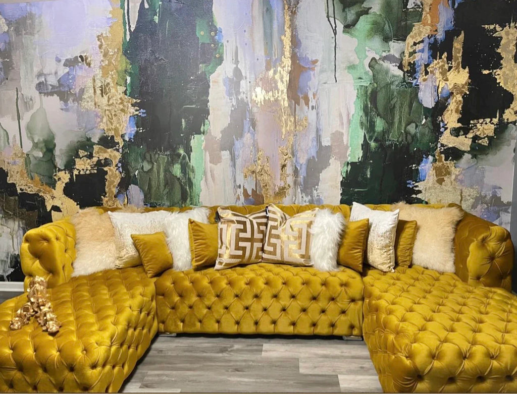 The installation of the green chartreuse gold and blue wallpaper mural took this luxury living room decor concept to the next level. The mustard tufted suede couch is s show stopping piece of furniture that fits in so nicely with the green and gold tones and textures of this wallpaper mural. 