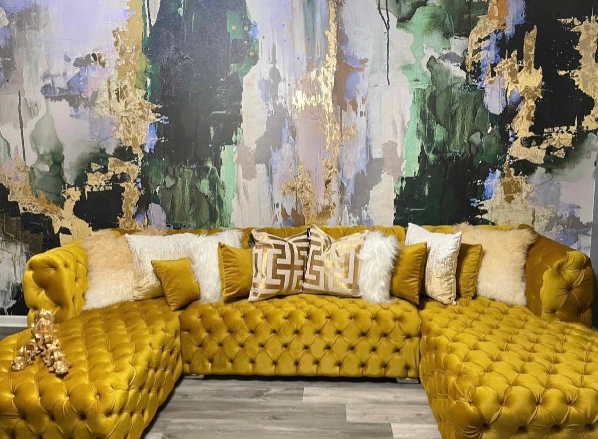 Green and gold living room with "Huntress" wallpaper accent wall
