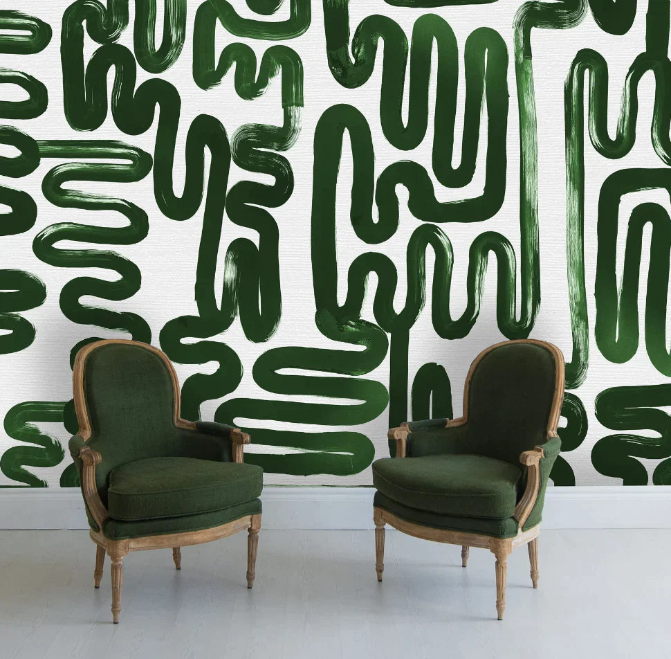 Green abstract brushstroke pattern is a mood with Green Luxury Classic chairs, white wood flooring, white baseboards. This luxury wallpaper design is the perfect choice for bold interior design needs in homes, offices, airbnb, hotels and other luxury settings.