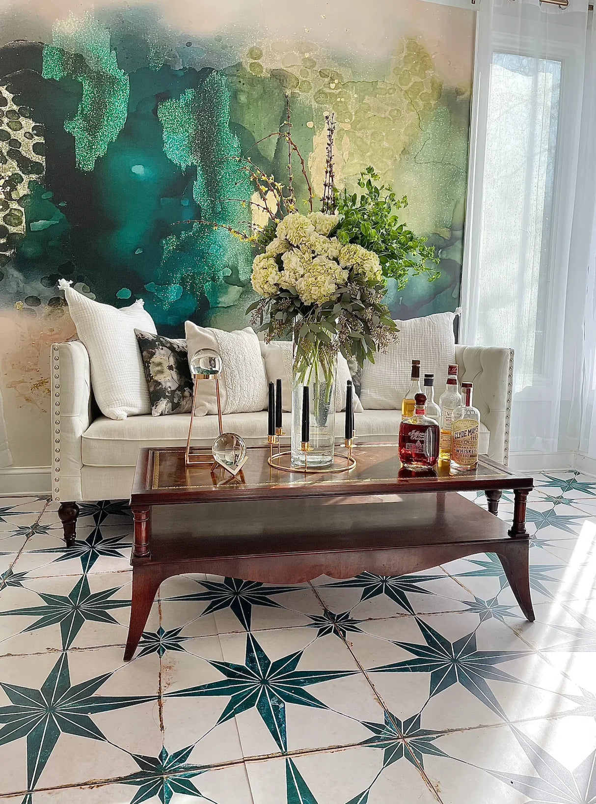 This amazing living room decor idea for abstract green wallpaper, white couch with white pillows, ornate wood coffee table, whisky products, floral arrangement, looking glasses and stunning tile flooring. This gold, green and beige abstract wallpaper design is a top pick for designers interested in bold, colorful selections. Great products for homes, hotels, airbnb, luxury vacation homes, spas, salons and any other luxury installation. The product is available in prepasted and peel and stick.