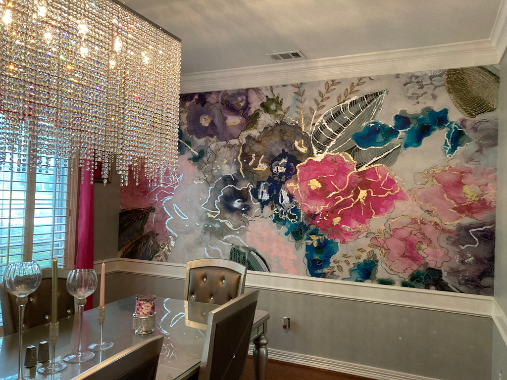 This customer photo shows the installation of the Vivian Ferne floral themed wallpaper design, Wisteria. This design is versatile with lush and rich fuchsia, turquoise, purples and silvers and golds. This abstract design will add texture, color and depth to a living room or dining room interior design concept.