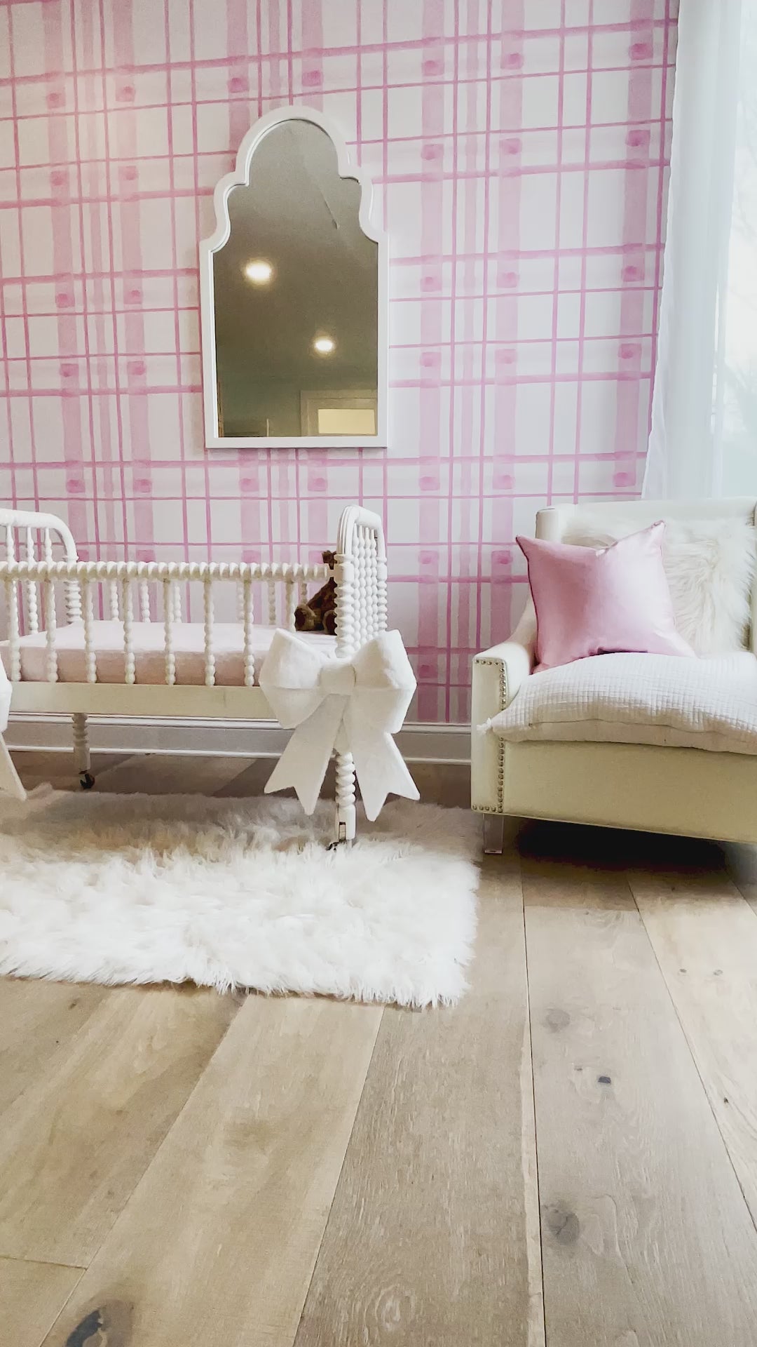 Installation video for a pink themed nursery. This peel and stick wallpaper is a great option for any pink themed child's space. The modern take on a classic interior design presents a calming bright wall decor option for customers. 