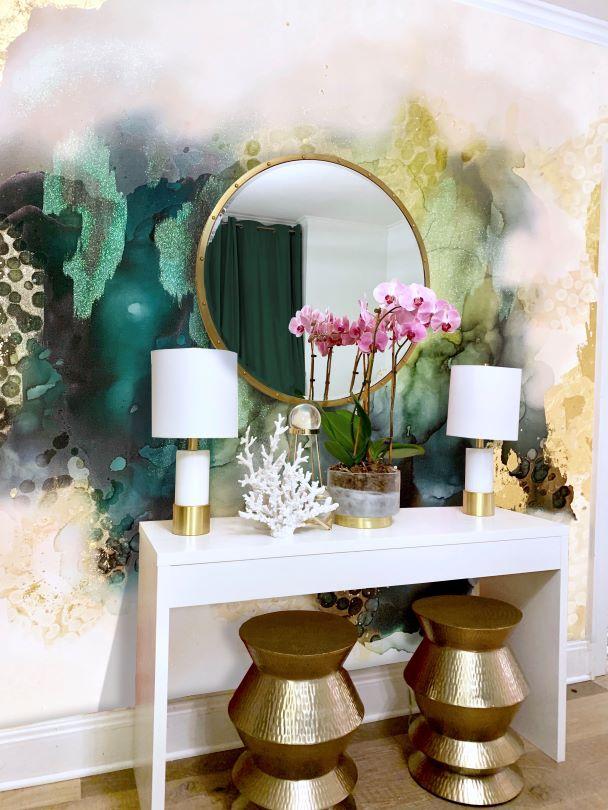 This amazing entry way decor idea for abstract green wallpaper, white table with white and gold lamps, ornate gold stools, trinkets, floral arrangement, looking glasses and stunning light wood flooring. This gold, green and beige abstract wallpaper design is a top pick for designers interested in bold, colorful selections. Great products for homes, hotels, airbnb, luxury vacation homes, spas, salons and any other luxury installation. The product is available in prepasted and peel and stick.