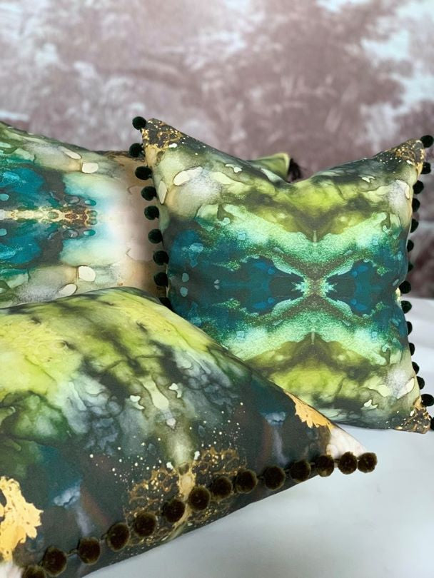 green emerald and jade pillow display in front of vivian ferne wall sticker