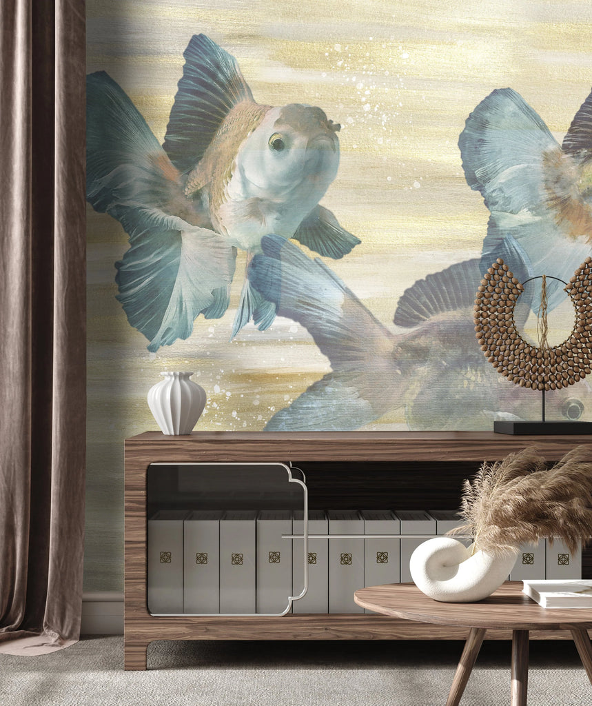This photo displays the original interior wall decor by Vivian Ferne. The wallpaper is inspired by Gold Fish and their beautiful curves, lines and textures. The stylized gold fish themed wallpaper design is available in a prepasted or peel and stick material. The image also features interior design elements such as large tv stand, coffee table, velvet drapes and beige baseboard. 