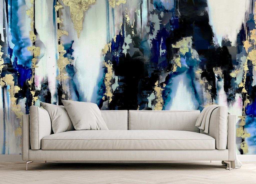This modern living room decor has a stunning abstract wallpaper mural filled with inky blues, blacks, gold and deep blues. These sweeping colors and textures create a moody edgy interior design aesthetic. Turn your living room decor into a masterpiece with this ultra modern interior wallpaper decor.