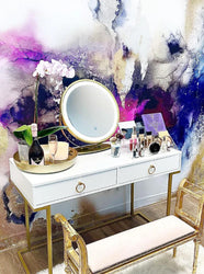 This bedroom interior design concept is a bold and modern theme with beautiful colorful  abstract wall art. The purples, raspberries, golds and textures on the wall decor allow the white and gold furniture standout. This abstract wall art is hand crafted in Columbus, Ohio by the women owned wallpaper design business. The designs are digitally created from original abstract artworks by famous abstract painter, Fran Maass Katz. 