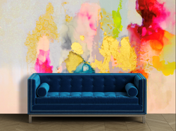 Blue couch in from of a pastel rainbow wall mural