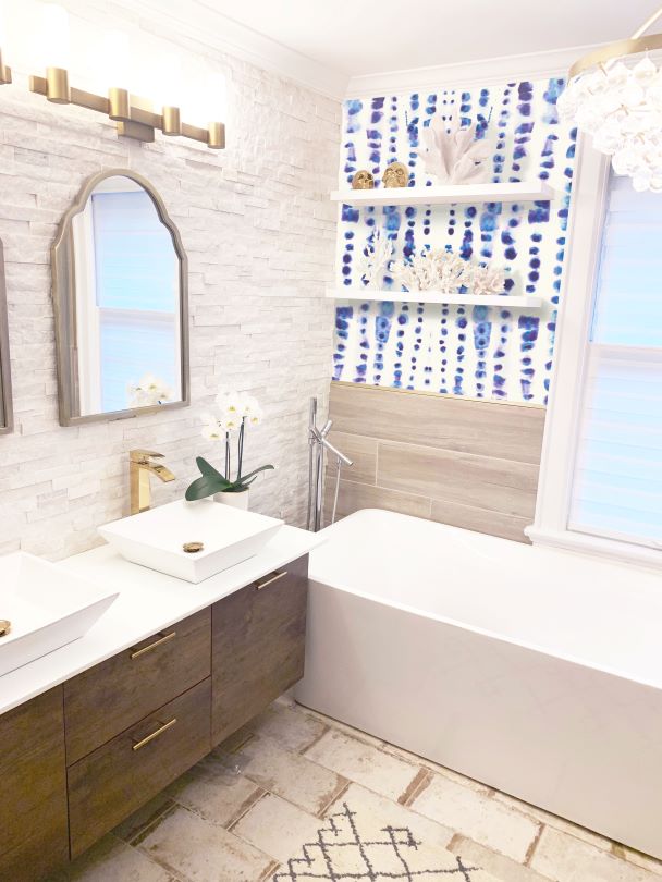 Blue with purple poka dot wall paper in gold accent bathroom