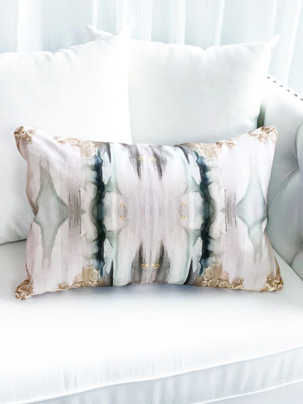 Sea green and smoky grey large pillow on a white couch